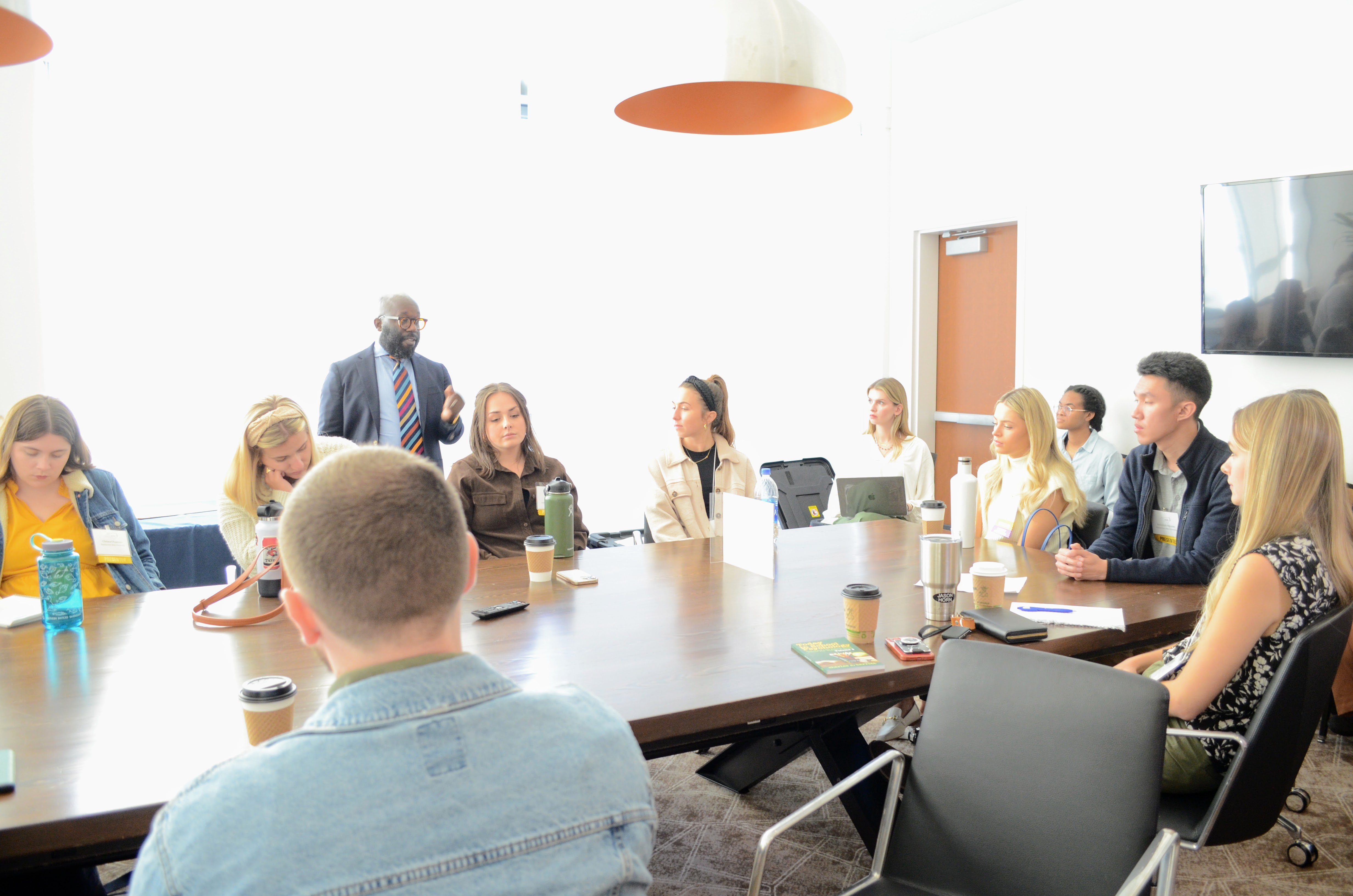 students around a conference room table